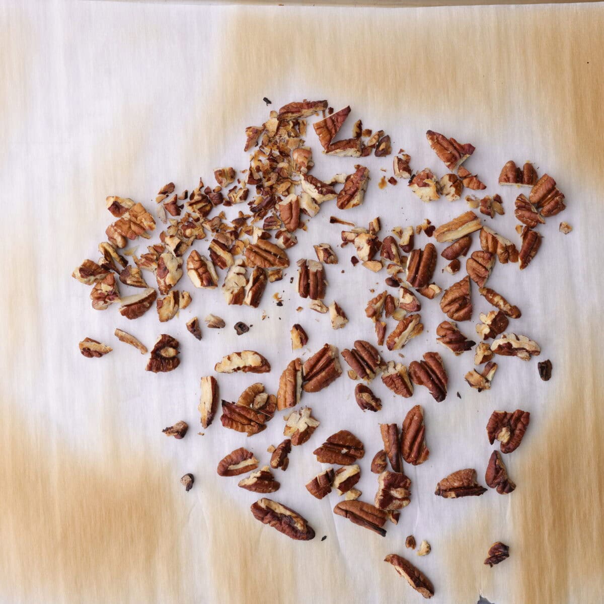 Pecans on a baking sheet, loosely chopped and roasted until fragrant and slightly browned. 