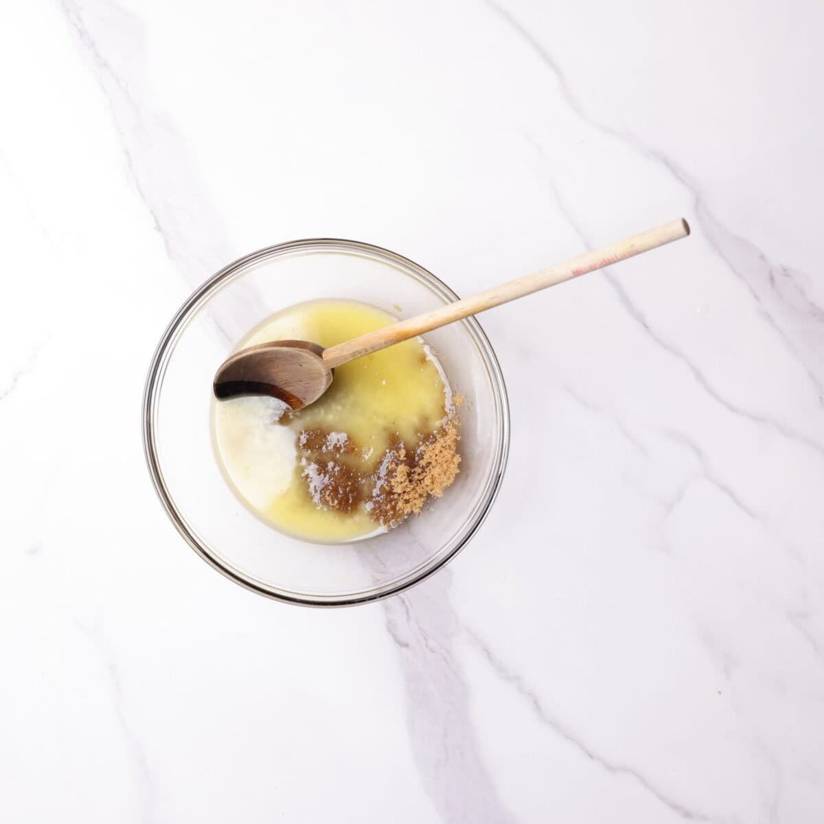 A bowl with melted butter and brown sugar.