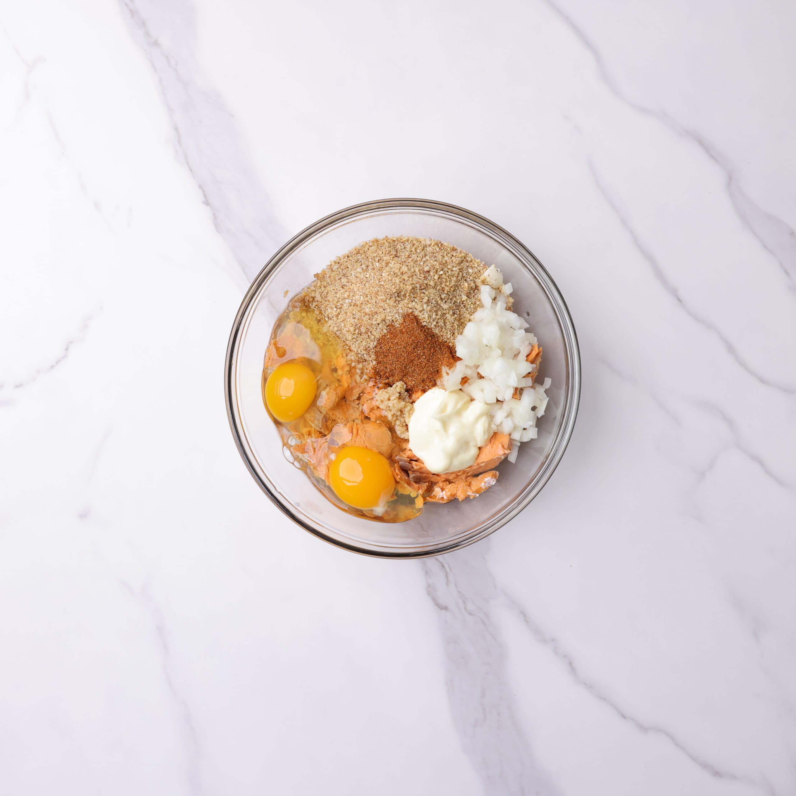 A bowl with all the ingredients for the Smoked Salmon Patties in it before they are mixed together. 