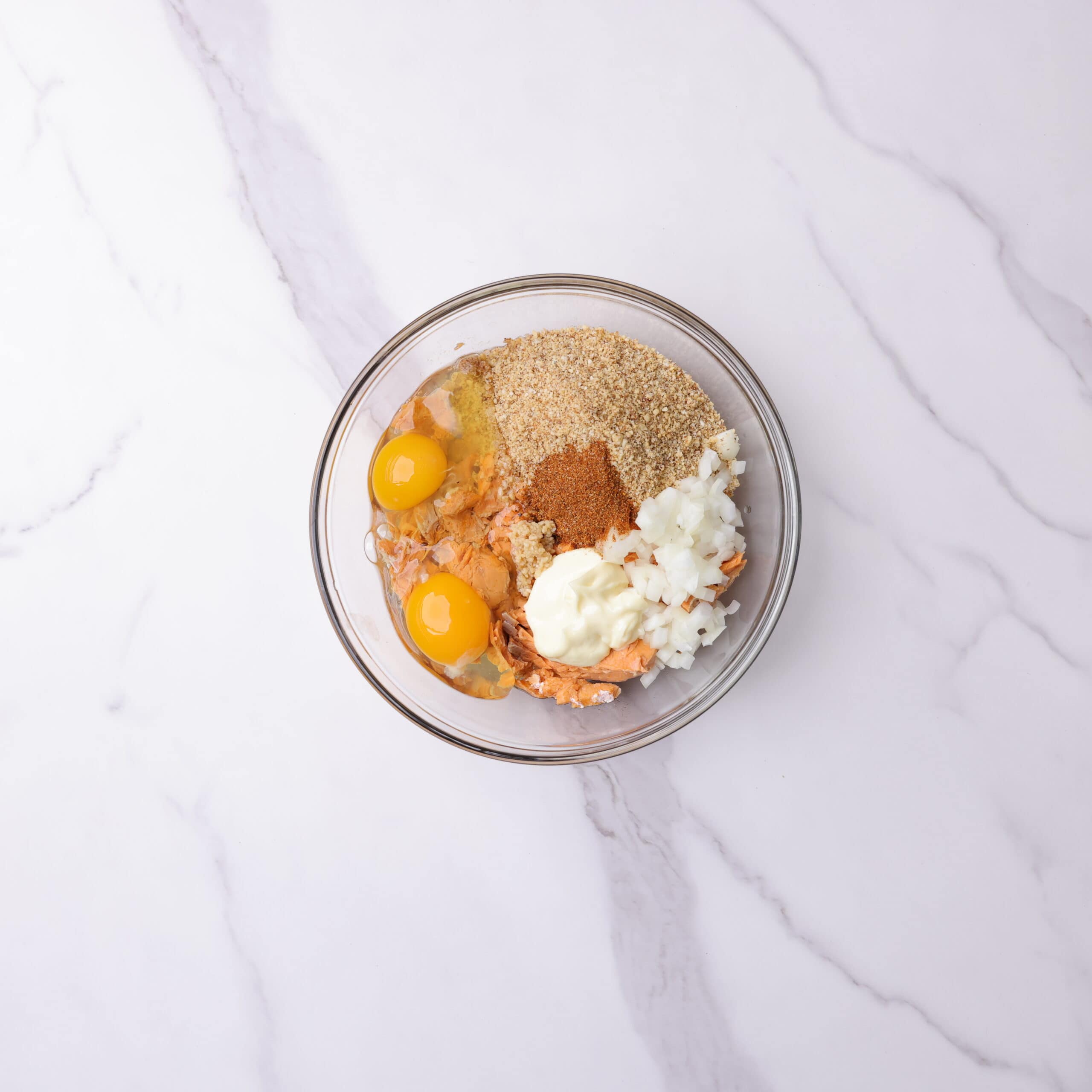 A bowl with all the ingredients for the Smoked Salmon Patties in it before they are mixed together. 