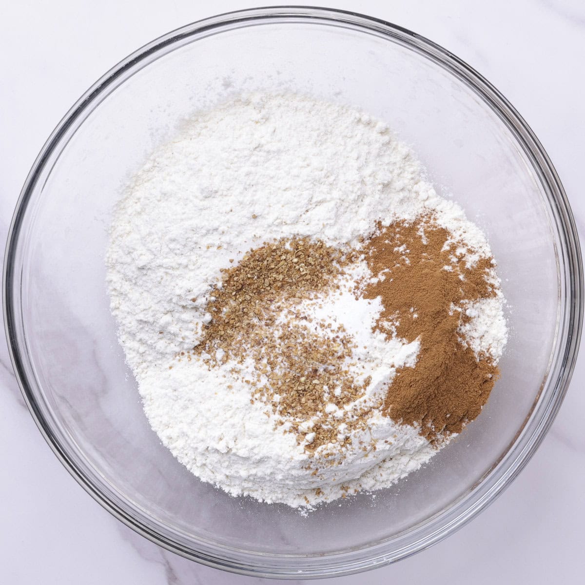 All the dry ingredients in a glass bowl.