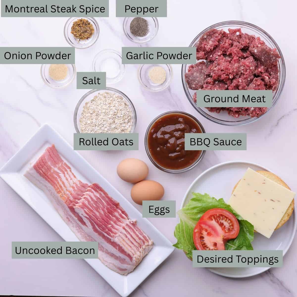 A visual display of the ingredients for Moose Burgers - ground meat, raw bacon, bbq sauce, eggs, rolled oats, onion powder, garlic powder, salt, pepper, Montreal Steak Spice and desired toppings (bun, lettuce, tomato)- each in their own bowl.