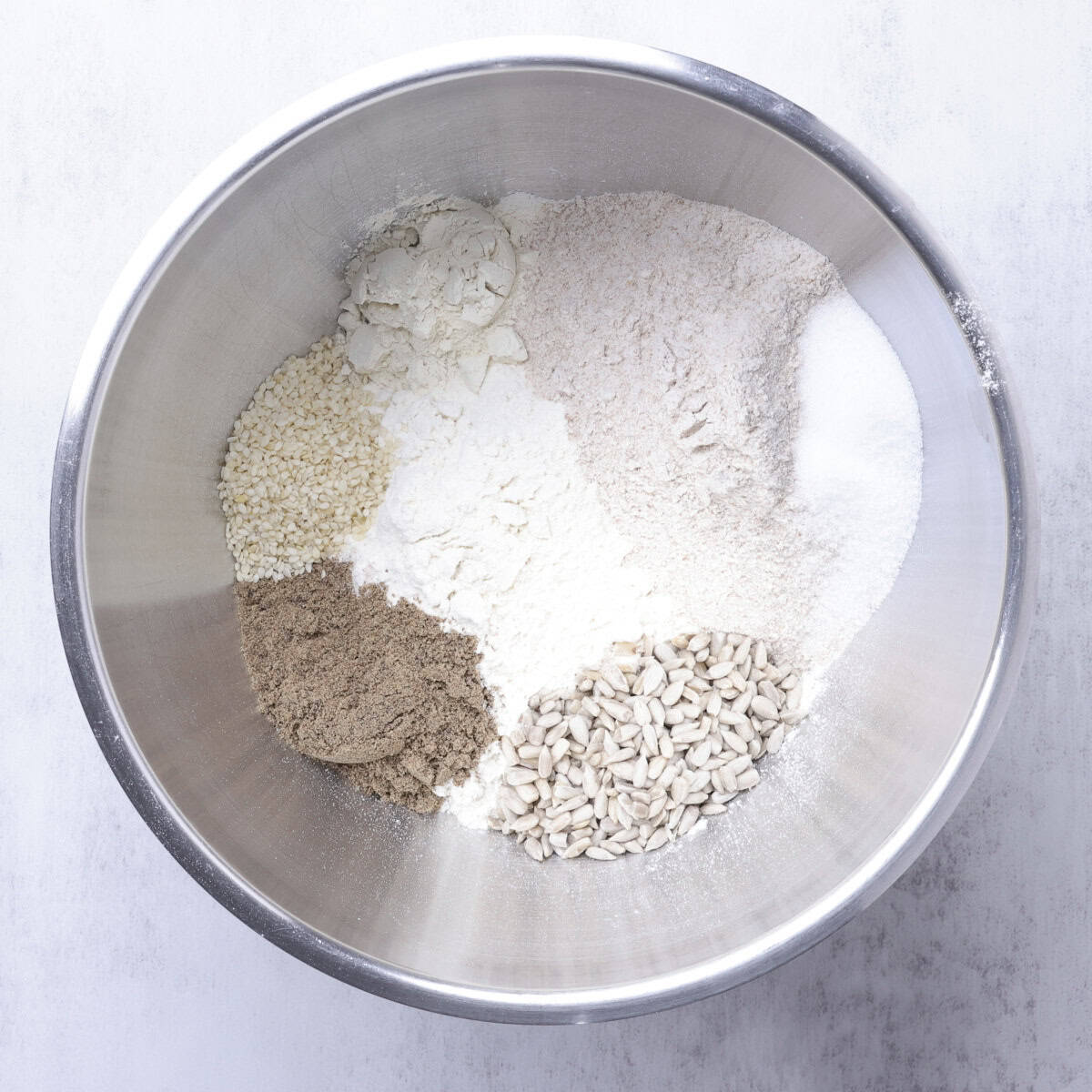 The remaining dry ingredients in the stand mixer bowl.