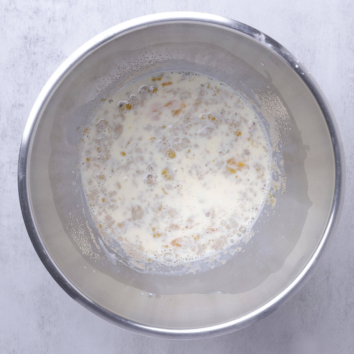 A mixing bowl with all the wet ingredients.