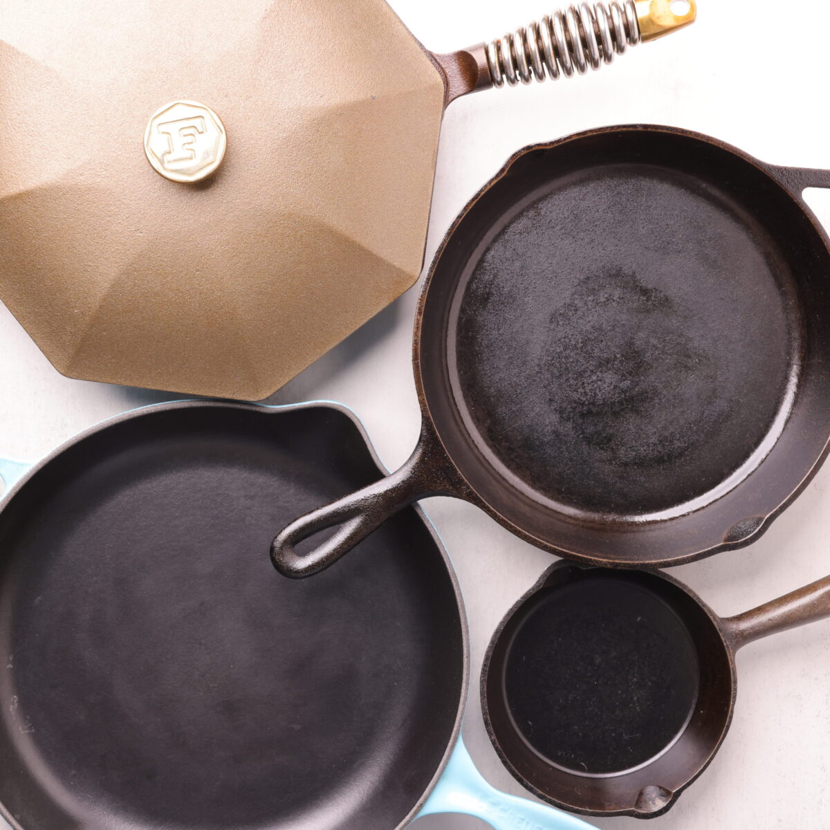 A compilation of skillets of varying size, styles and colors.
