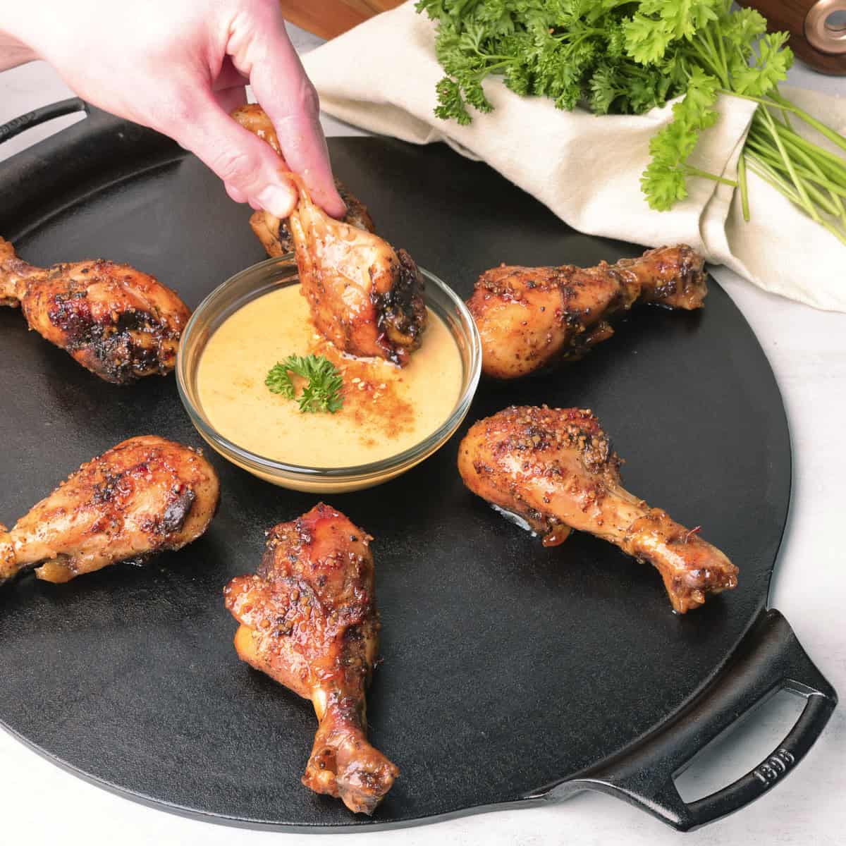 Sticky Chicken Drumsticks Dipping Drumstick in Mustard Sauce