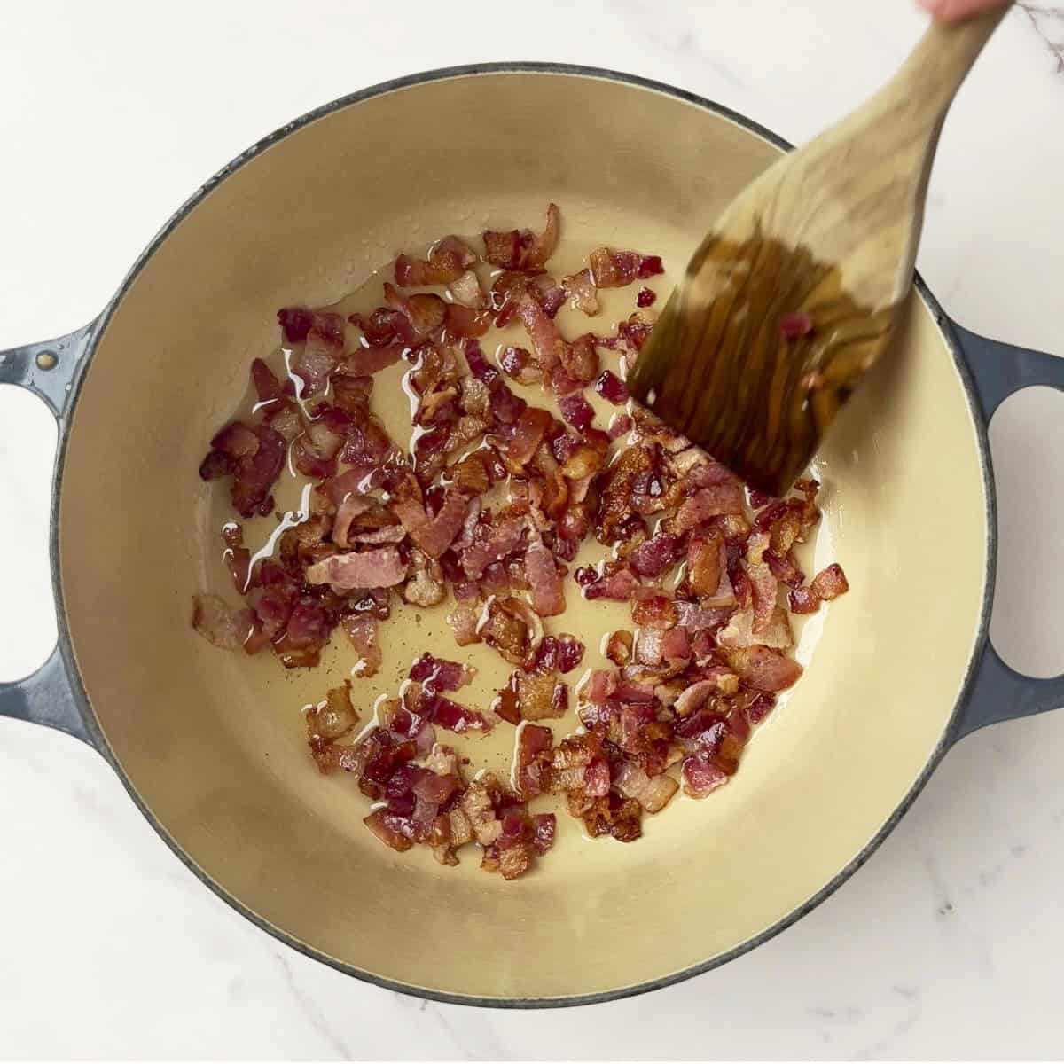 The bacon browned in the pot.