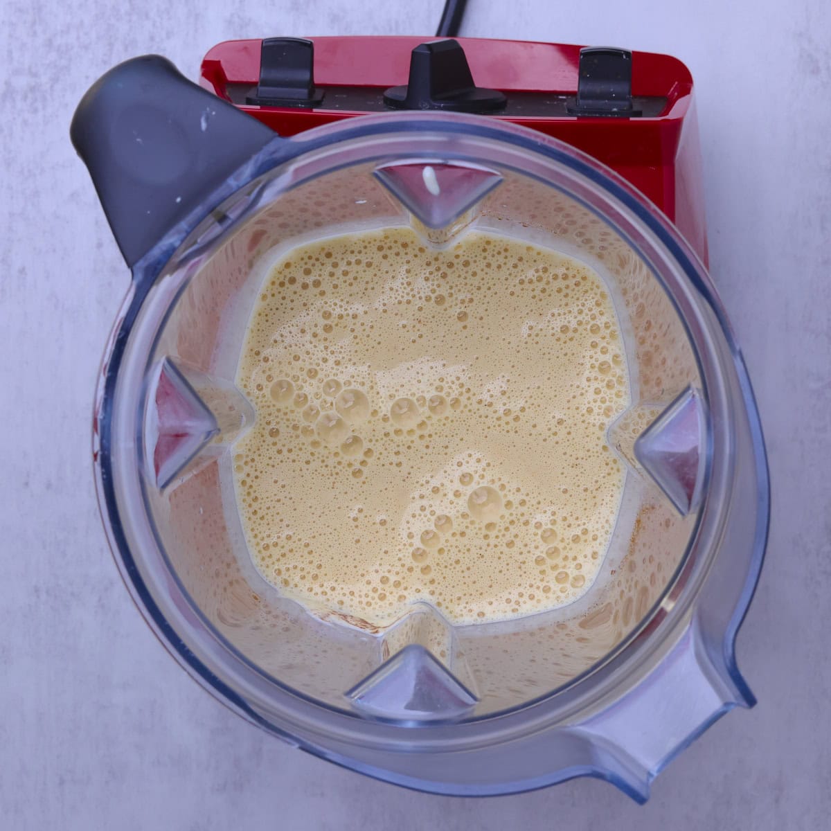 A blender filled with the batter for the Sourdough German Pancake.