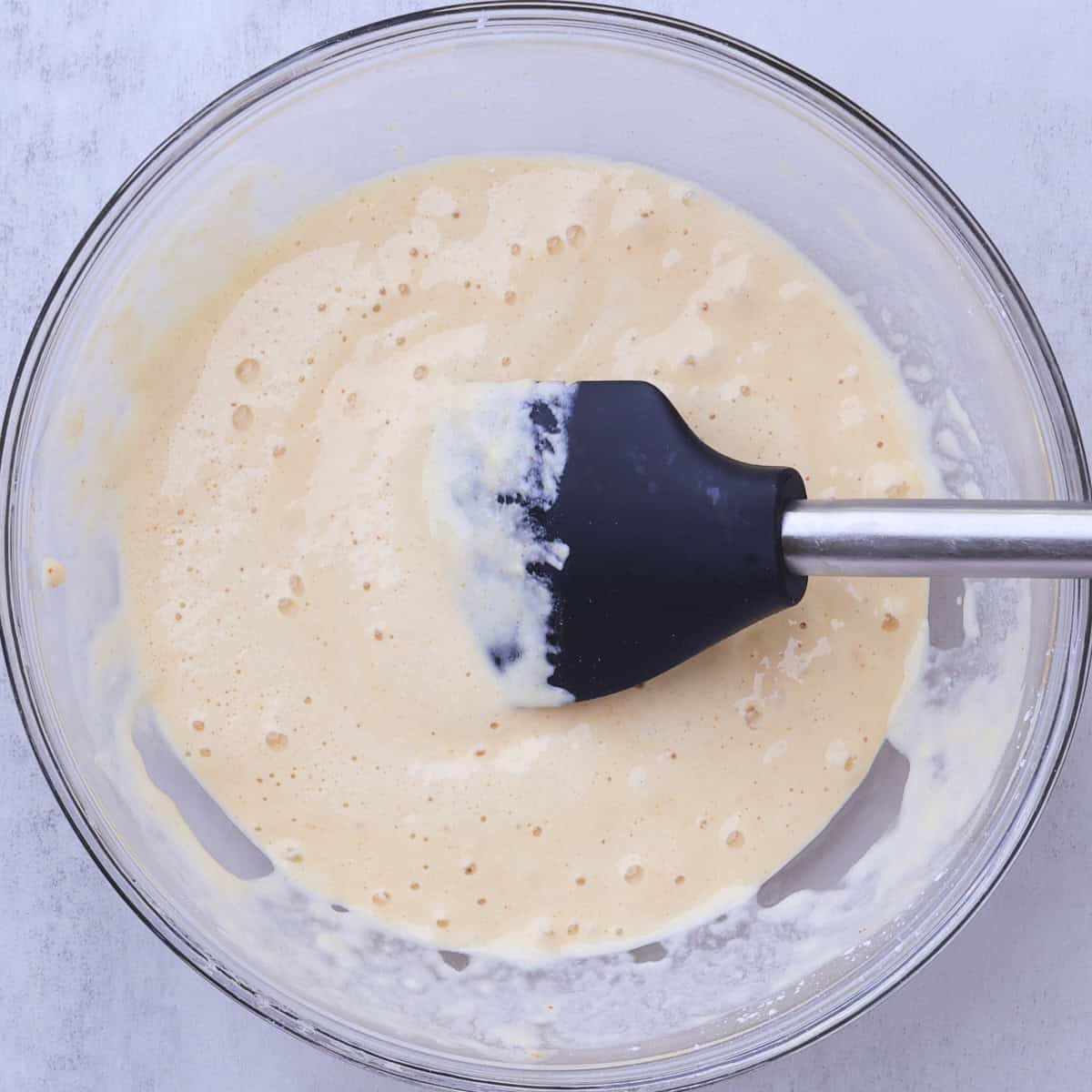 A bowl with the finished beer batter in it.