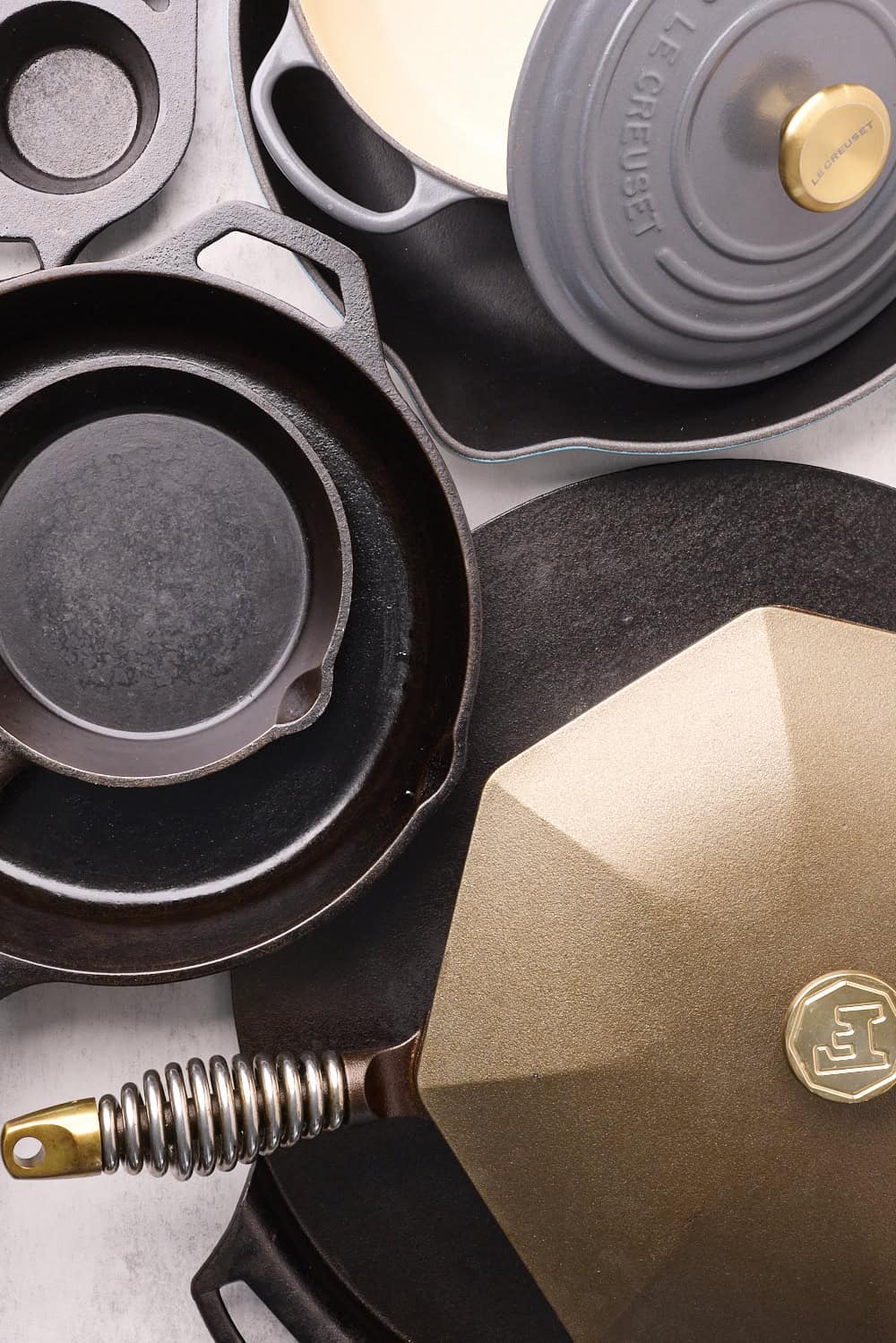 Alaskan Skillet cast iron cookware with lid and handle in close-up.