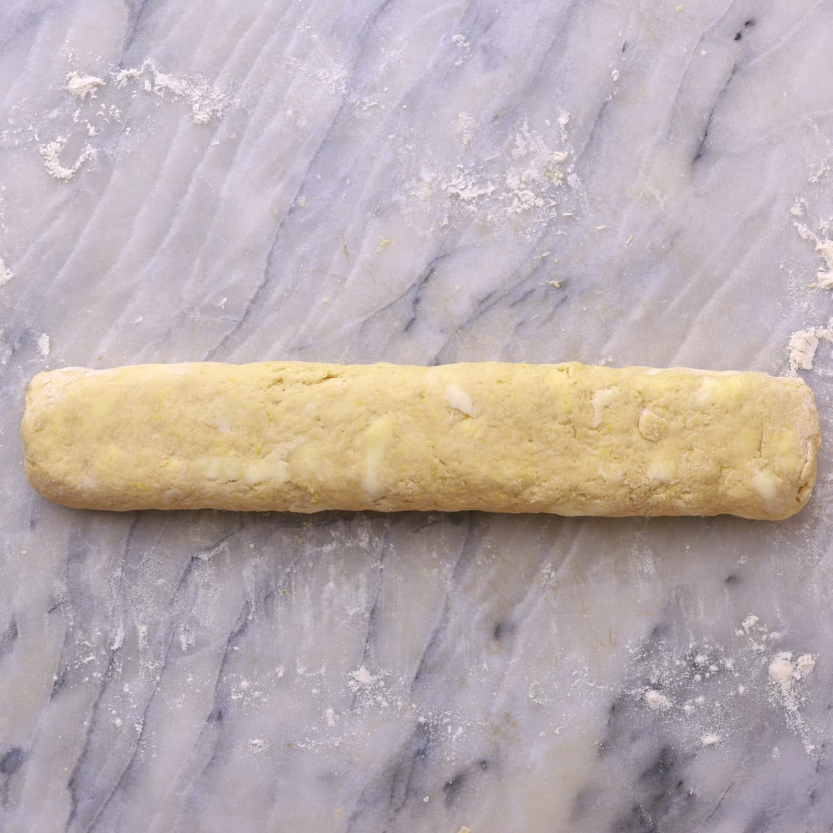 A formed log of the rolled up dough and fillings.