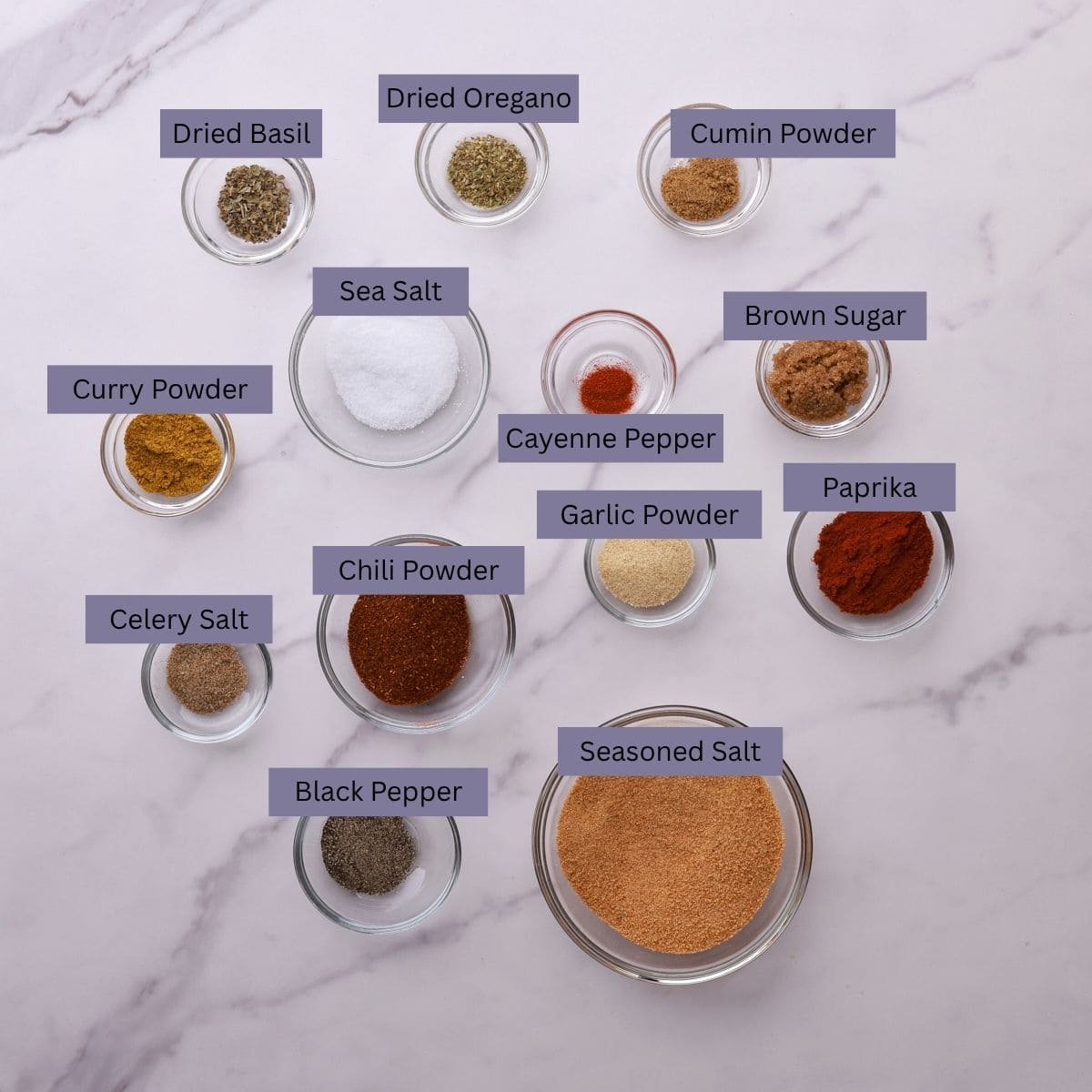 A visual display of all the ingredients needed for the salmon spice, each spice displayed in their own bowl.