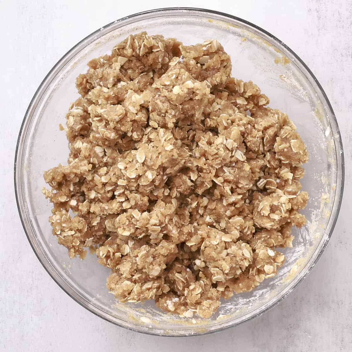 A glass bowl of crumb topping.