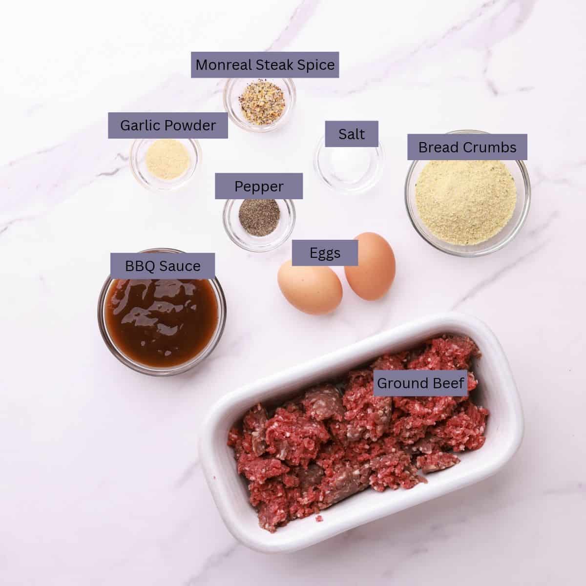 A visual display of the ingredients needed for the Crockpot BBQ Meatballs - breadcrumbs, salt, Montreal Steak Spice, garlic powder, pepper, eggs, ground beef and bbq sauce - each displayed in their own bowl.