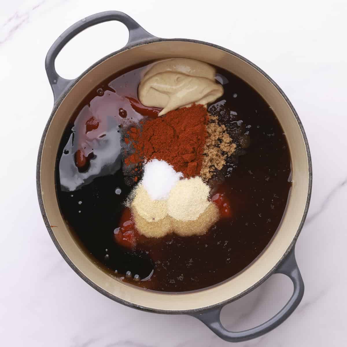 A pot with all of the ingredients needed for the BBQ sauce.
